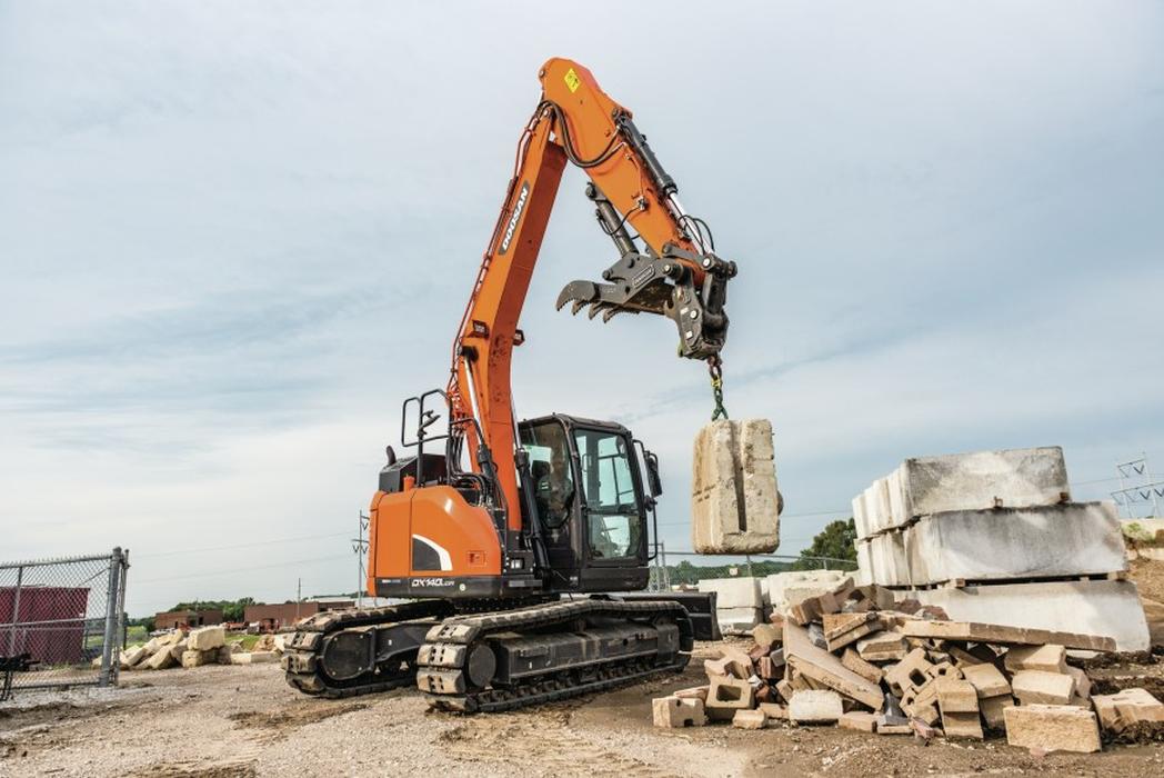 DOOSAN HEAVY DUTY EQUIPMENT at WOC on display will be a a tool carrier with a quick coupler and pallet fork and a crawler excavator with a quick coupler and hydraulic breaker.